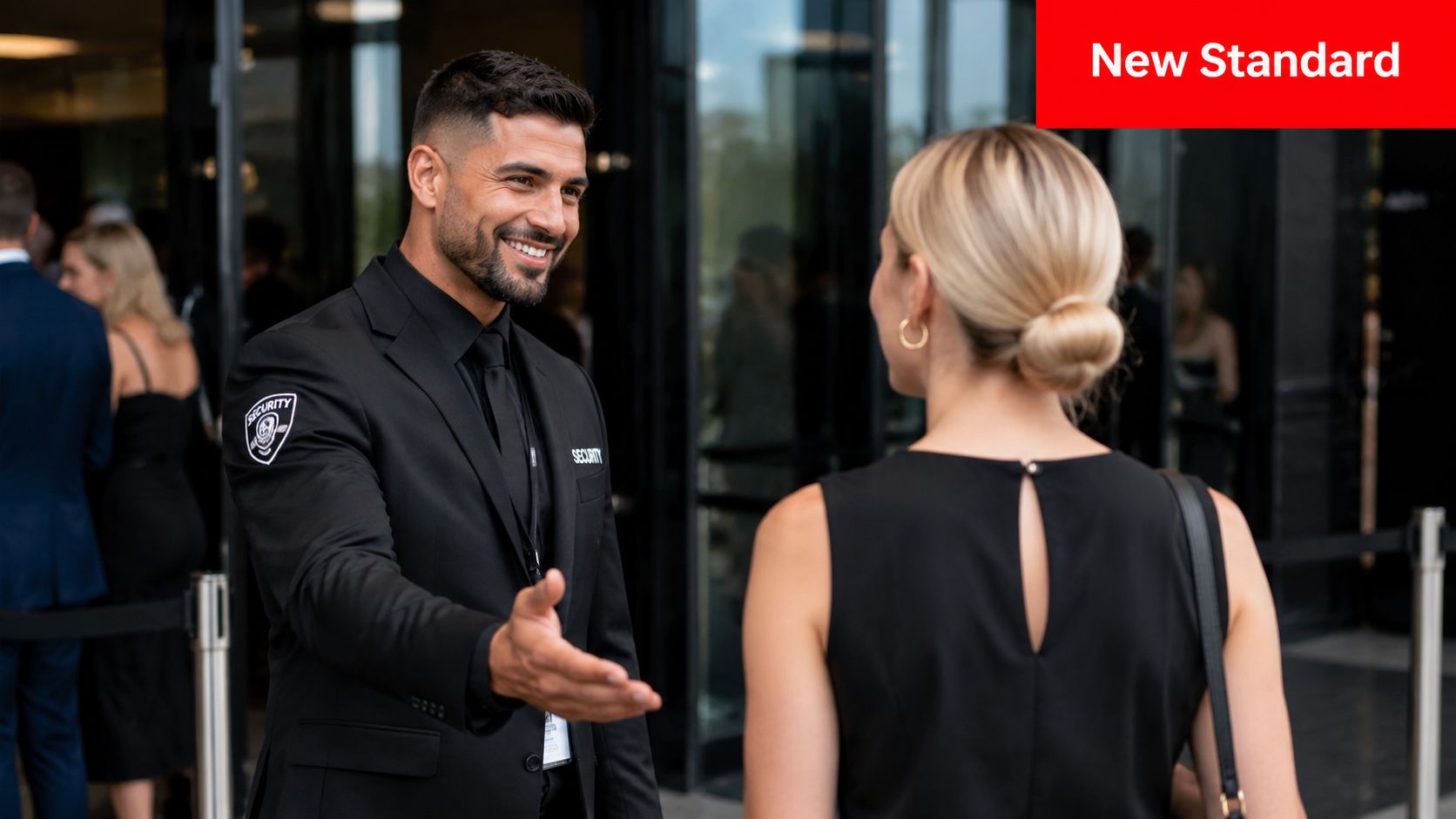 Master Customer Service Excellence: Boost Your Brand 1 A friendly security guard in a suit greeting a woman at an event entrance.