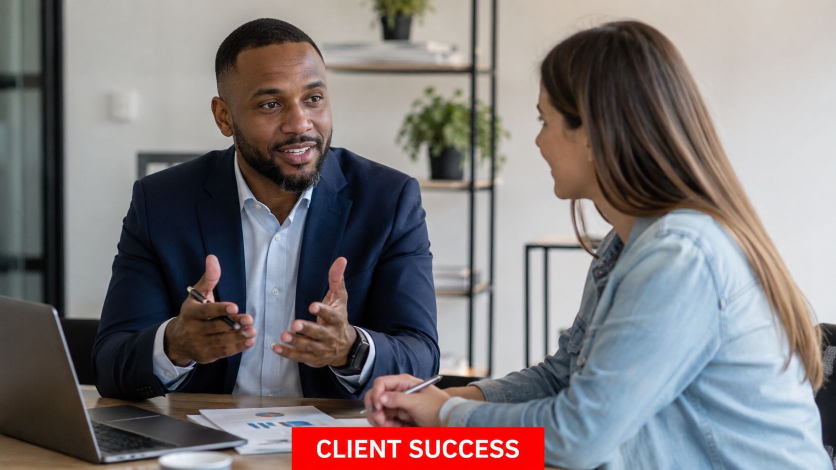 7 Amazing Client Relationship Management for Security 3 A professional man and woman having a productive conversation during a business meeting in an office.