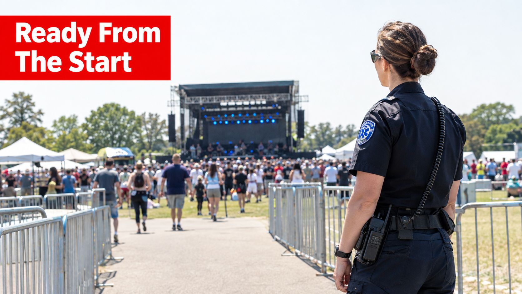 Emergency Response Services 7 Ways to Stay Safer 1 A female police officer stands overlooking a crowded outdoor music festival with a stage in the background.